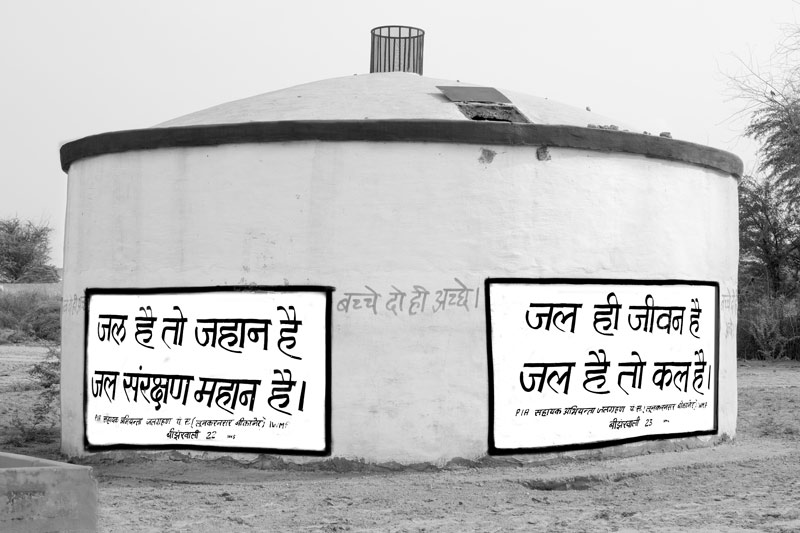 Integrated Solution for Rural Drinking Water Challenges - IEC messages, describing the indispensability of water, written on the walls of a storage tank in a rural water supply scheme in district Bikaner, Rajasthan